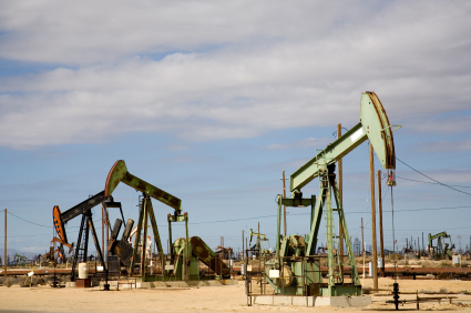 Oil Well pumping crude oil into a pipeline.