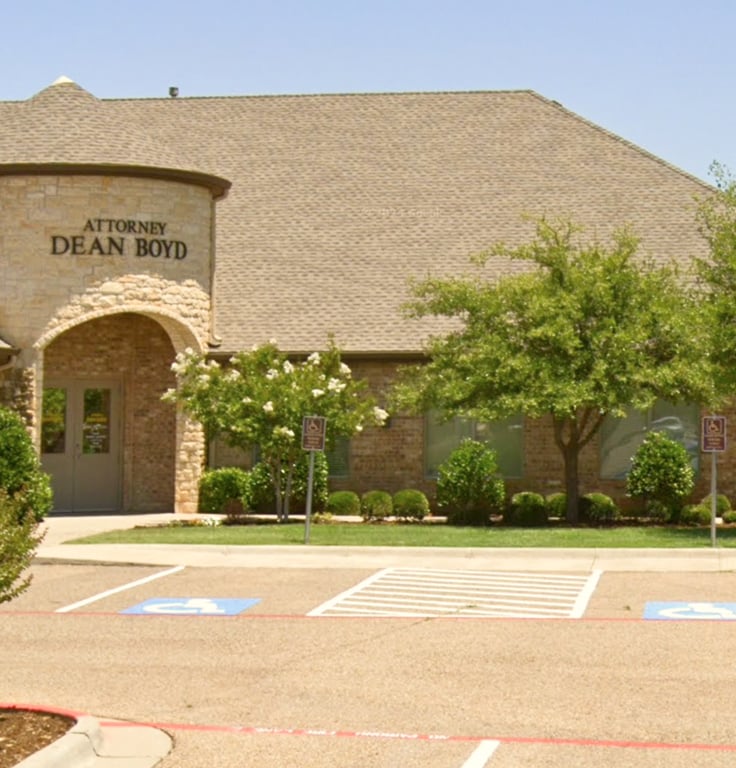 Attorney Dean Boyd Lubbock Office building exterior with parking lot.